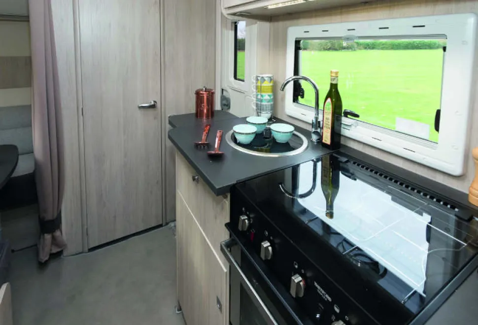 A-hinged-surface-extension-comes-across-the-doorway.-When-it’s-in-use,-there’s-58cm-of-surface-with-the-hob-and-sink-lids-down-w800-85605