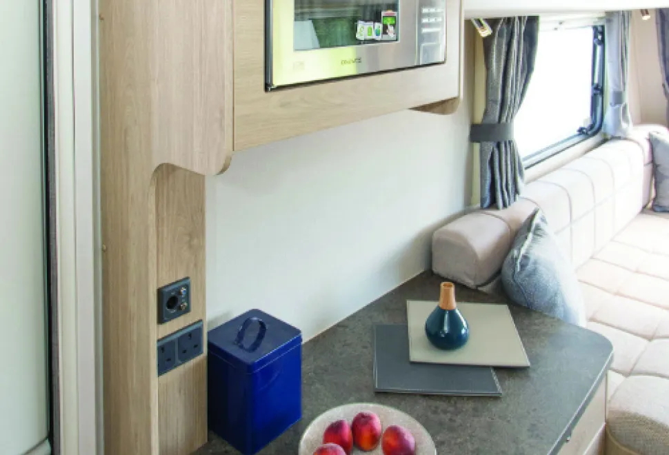 A-capacious-double-doored-cabinet-below-the-dresser-and-a-microwave-at-a-convenient-height-for-most-people2-w500-16307