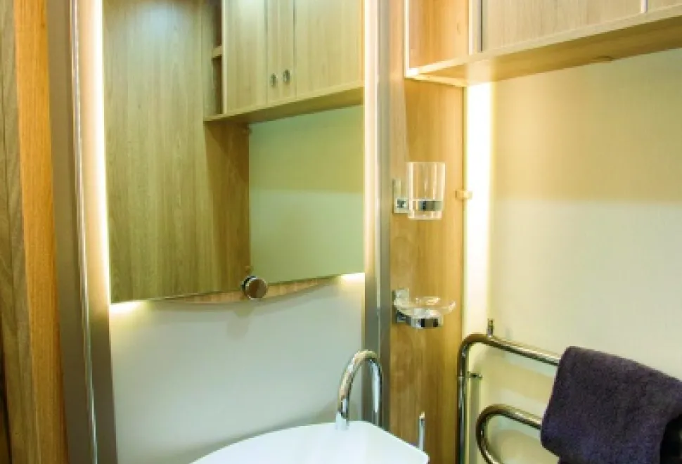 A-heated-towel-rail-and-lights-along-each-side-of-the-mirror-32427