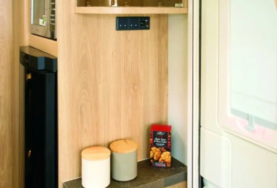 Connections-for-a-TV-are-here,-with-a-fitted-drinks-cabinet-above-31912