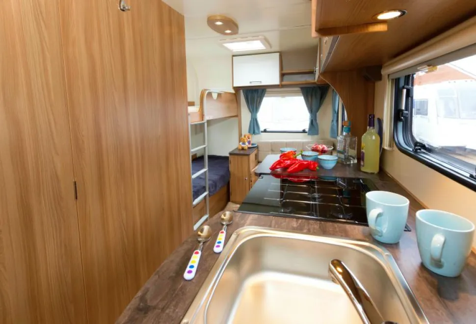 A-lengthy-kitchen-and-a-spacious-family-area-beyond-44609
