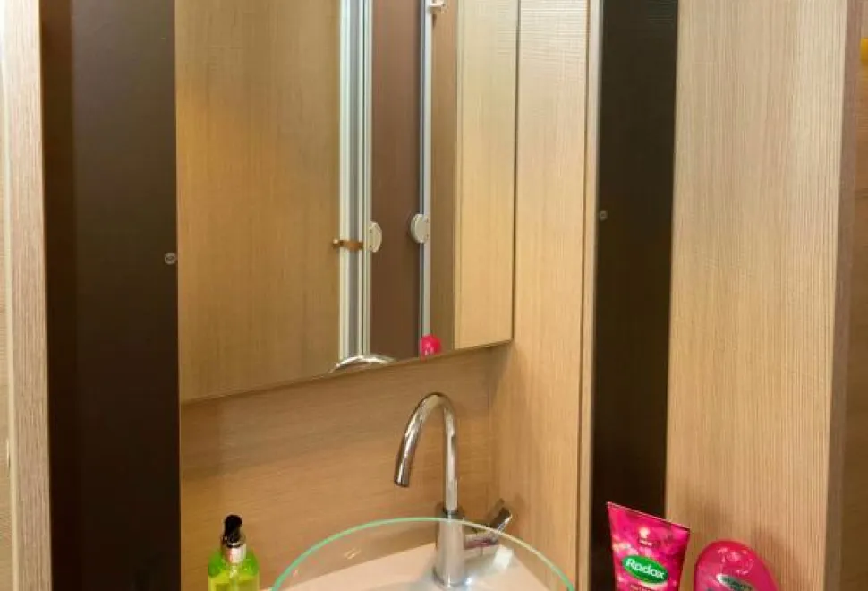 Slim-cabinets-flank-the-mirror;-the-bowl-has-a-pop-up-plug-95560