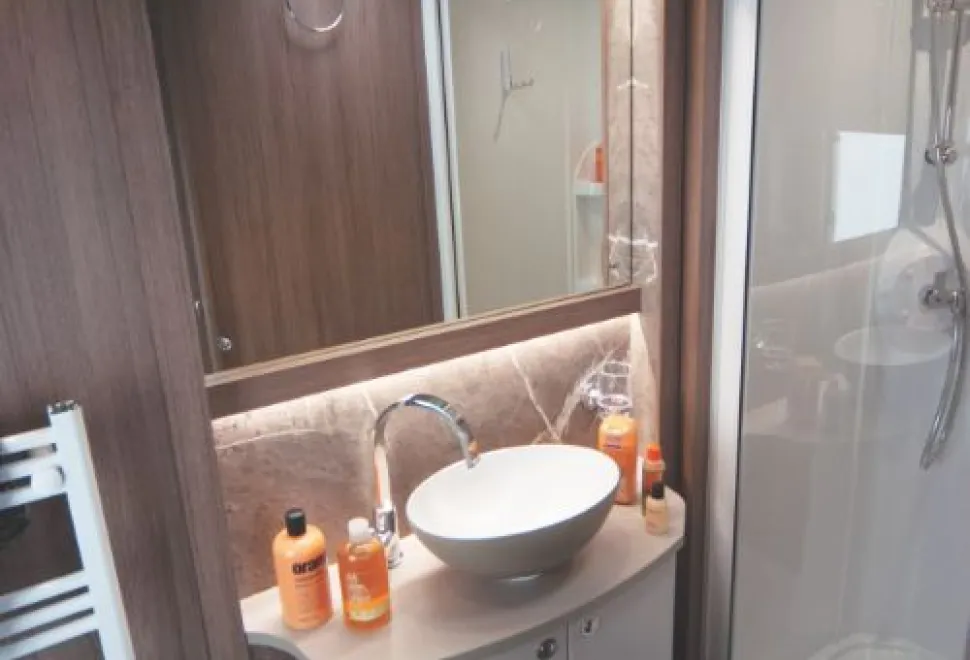 A-new-style-basin,-with-a-fawn-exterior,-sits-on-an-equally-new-style-cabinet-20736