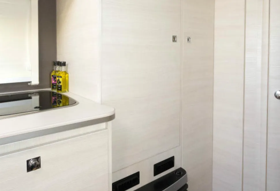 A-good-sized-wardrobe-with-a-shelved-cabinet-alongside-it-35288