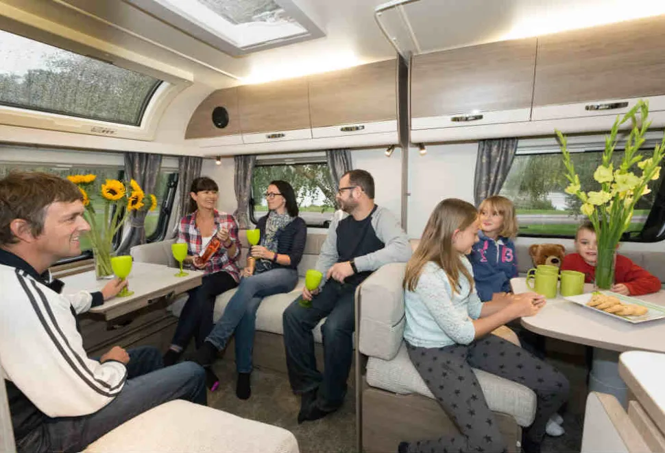 Two-familes,-seven-people-and-a-teddy-bear-in-two-seating-areas-31130