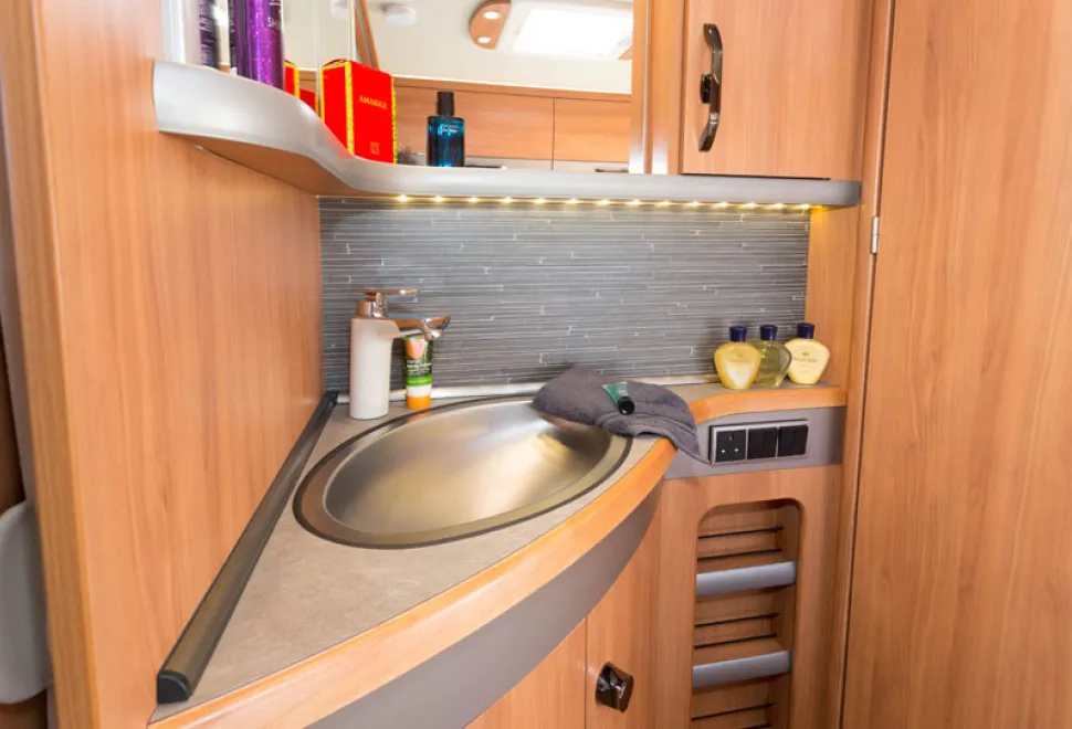 web-4-The-vanity-area-alongside-the-bed-has-plenty-of-cabinet-and-shelf-space3-14899