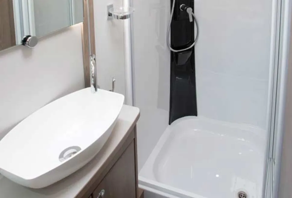 Style-is-in-plentiful-supply-here-with-a-surface-mounted-basin-and-a-black-panel-in-the-shower-49742