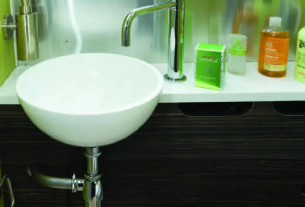A-small-washbasin---and-a-built-in-soap-dispenser-on-the-wall-w350-70454