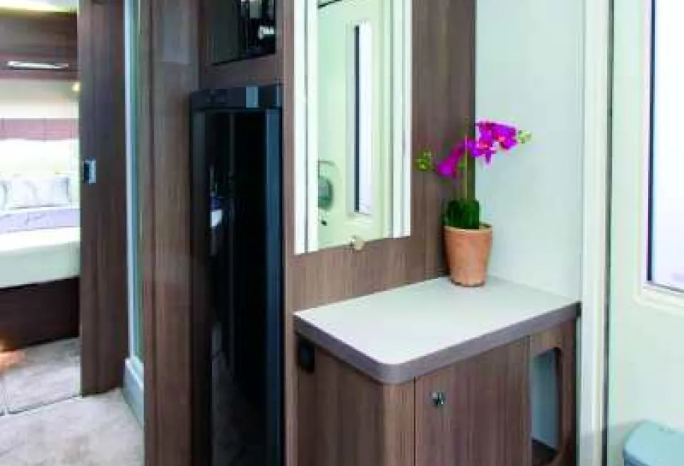 By-the-door-is-a-cabinet-ideal-for-shoes-and,-alongside,-the-155-litre-fridge-freezer-42422
