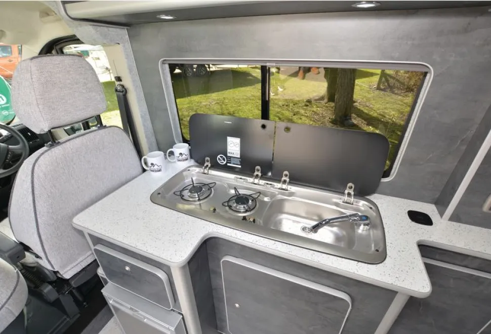 The Custom Built Campervans high-top rising roof campervan kitchen