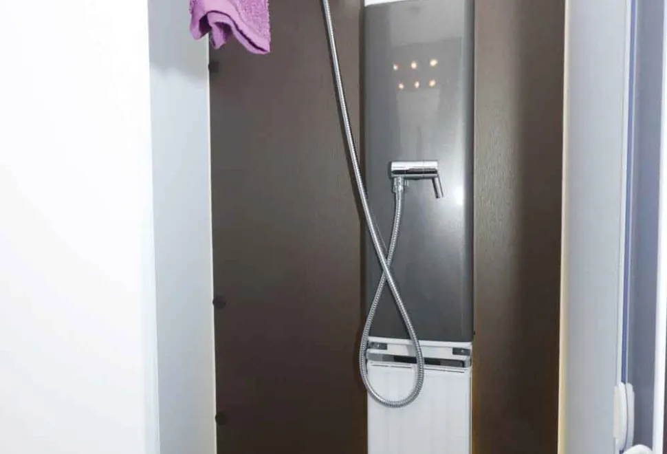 A-bar-style-towel-rail-and-a-panel-radiator-in-the-shower-79687