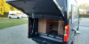 Redesigned rear with top-hinged garage door