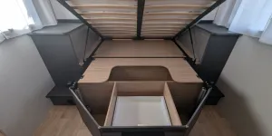 Storage under the island bed is good and the bed lifts up and stays up for access