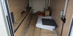 The garage is a useful space with a light, tie down points and a shower at the far end