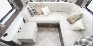 A sumptuous L-shaped lounge with a free- standing seat