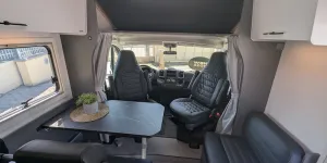 Etrusco A 6.9 SB 2026 motorhome showing overcab bed base raised and cab seats swivelled