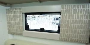 Bailey Alora 69-4S motorhome panels either side of a frosty window