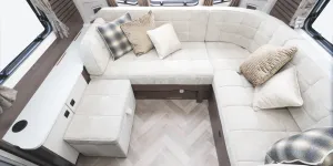 A sumptuous L-shaped lounge with a freestanding seat