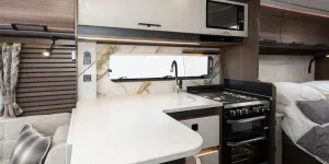 The L-shape of the kitchen creates a large surface