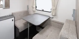 A seating area that transforms into bunks