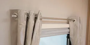 Eyelet-style-curtains-hang-on-bold-chrome-cafe-style-poles-84382