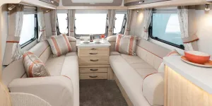 The-coppery-orange-shade-in-the-cushions-and-piping-detail-injects-warmth-to-the-look;-the-fabric-scheme-is-called-Sahara-77227