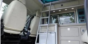 The-Orange-Trouvaille-campervan-bed-access-53756