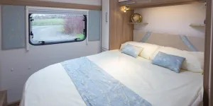 web-5-A-unique-layout-bedroom-with-upholstered-panels-bordering-the-window-43277