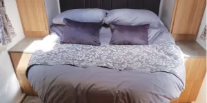 The Bailey Pegasus Grande GT75 Portofino caravan bedroom