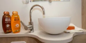 The-circular-washbasin-looks-so-high-end-domestic,-sitting-up-on-top-of-the-cabinet-w800-87705