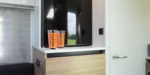 Alongside-the-fridge,-the-white-door-leads-to-a-Tardis-like-shower-room-w350-66690