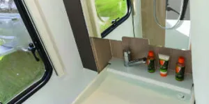 A-large,-shallow-basin-hinges-down-from-within-the-mirrored-cabinet-w350-67247