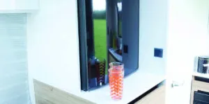 The-fridge-is-forward-of-the-kitchen-above-a-cabinet-of-drawers-w350-69815