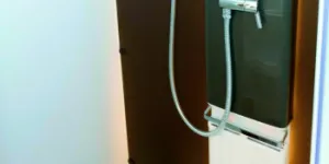 A-panel-radiator-in-the-shiwer-cubicle-and-a-rail-above-it-for-towels-to-dry-efficiently-65344