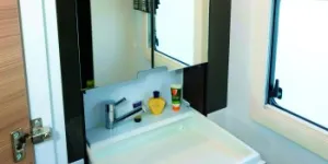 A-substanttial-washbasin-findes-down-from-within-the-mirrored-cabinet-64844