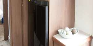 A-drinks-cabinet-alongside-the-tower-style-fridge--70313