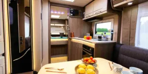 A-large-table,-good-sized-kitchen-and-a-cosy-bedroom-beyond-14082