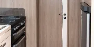 When-this-door-is-closed-the-bedroom-and-washing-facilities-form-a-cohesive-en-suite-arrangement-23856