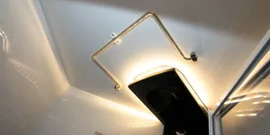A-hinged-towel-rail-is-mounted-in-the-shower-cubicle-ceiling-27434