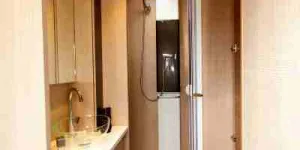 A-panel-radiator-with-a-towel-rail-above,-within-the-shower-cubicle-07854