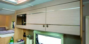 The-top-locker-design-is-stunning,-with-the-mirrored-microwave-set-flush-into-the-pale-matt-finish-woodwork--01222