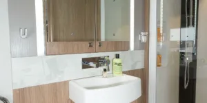A-mirror-bordered-by-light-strips-in-the-centre-of-the-washroom-w500-83968