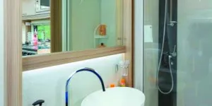 Lighting-runs-both-above-and-beneath-the-large-mirror-49083