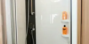 Two-good-sized-shelves-for-shampoos-are-in-the-shower-cubicle-48052