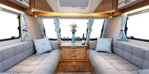 Soft-grey-and-pastel-blue-with-bold,-blackberry-colour-in-the-curtain-and-cushion-pattern;-a-lovely-colour-scheme-2-89335