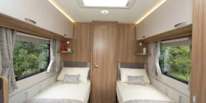 Bright-light-above-the-white-top-locker-doors-and-two-big-windows-enhance-the-spacious-look-of-the-bedroom-w800-34886