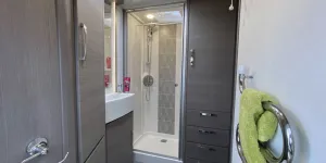 Two-wardrobes-are-in-the-large-shower-room.-Notice-the-rock-effect-&rsquo;tiling&rsquo;-panel-in-the-shower-and-the-Alde-towel-warmer;-very-rerfined-33191