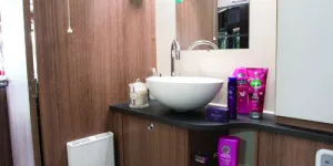 The-washbasin-has-a-rise-and-fall-plug;-the-cabinet-beneath-contains-a-linen-bag-w500-42852
