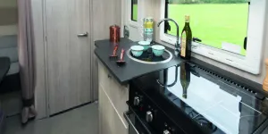 A-hinged-surface-extension-comes-across-the-doorway.-When-it’s-in-use,-there’s-58cm-of-surface-with-the-hob-and-sink-lids-down-w800-85605