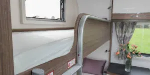 Two-bunks,-each-with-a-large-window-alongside-w350-53607
